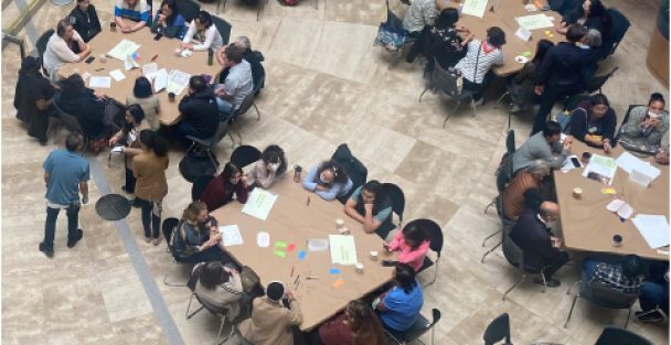 Strategic planning workshop participants collaborating at tables