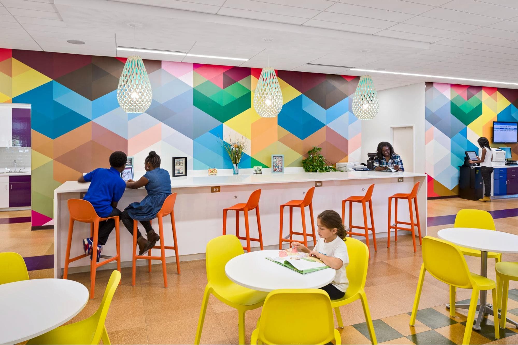 Richland Library area filled with desks and murals. Photo courtesy of Richland Library