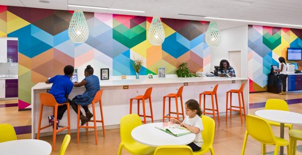 Richland Library area filled with desks and murals. Photo courtesy of Richland Library